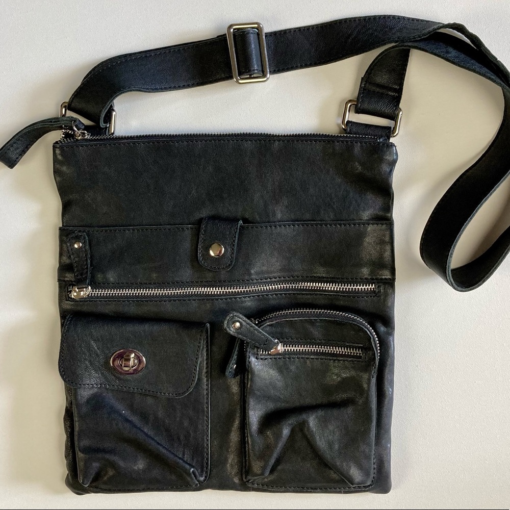 Crossbody. Genuine leather. Silver hardware.